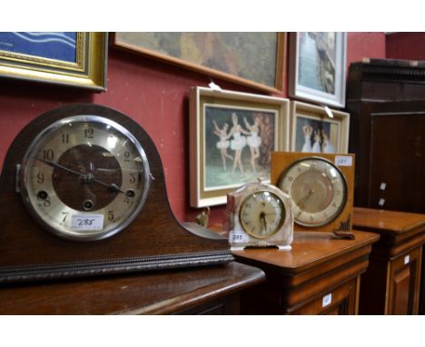 An early 20th century oak mantel clock; others (3)