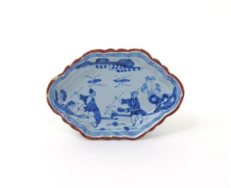 A delftware hexagonal spoon tray  2nd half 18th century, perhaps Vauxhall, painted in blue with two Chinese figures dancing w