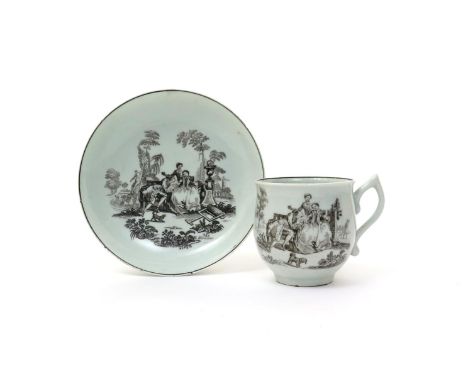 A Worcester printed cup and saucer  c.1762, the bell-shaped cup with a wishbone handle, printed in black with L'Amour, the cu