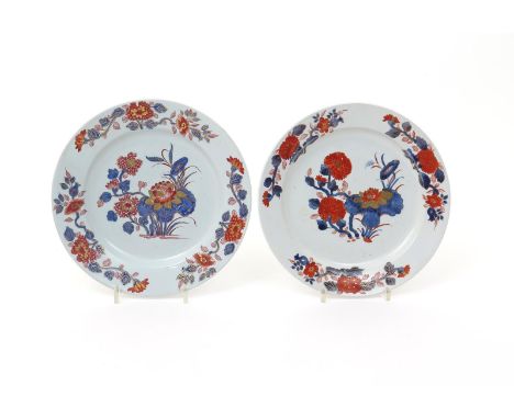 A close pair of Doccia plates  c.1755-60, well decorated in the Imari palette with sprays of lotus and chrysanthemum to the w