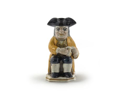 A pearlware Toby jug  c.1810, painted in Pratt type colours with an ochre frock coat, green waistcoat and blue breeches, his 