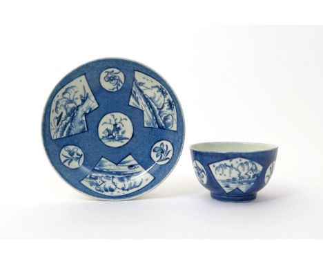 A Worcester blue and white teabowl and saucer  c.1760-70, decorated with the Fisherman in a Fan-shaped Panel pattern, with th