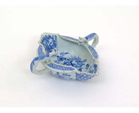 A good Liverpool delftware two-handled sauceboat  mid 18th century, the interior painted in blue with birds perched on sprays