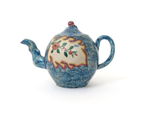 A salt-glazed stoneware teapot and cover  c.1760, painted to each side with a simple floral sprig within a leaf-shaped panel,