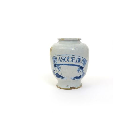 An early English delftware dry drug jar  dated 1663, simply painted in blue with a ribboned banner bearing the inscription 'D