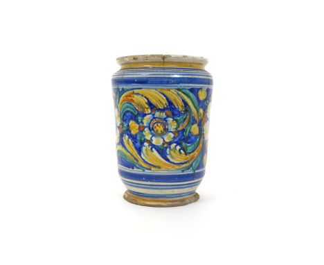 A large Sicilian maiolica albarello  probably 18th century Caltagirone, boldly decorated with a continuous band of large and 