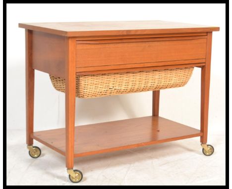 A vintage retro 20th Century Danish teak wood sewing / work box, solid flared&nbsp;top over full length drawer with a rattan 