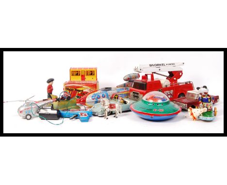 A collection of assorted vintage tin plate mechanical clockwork toys to include; German horse , Chad Valley Alarm Squad Car ,