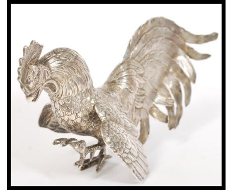 A vintage 20th century silver hallmarked large figurine of a fighting cockerel bearing London import marks and date letter m.