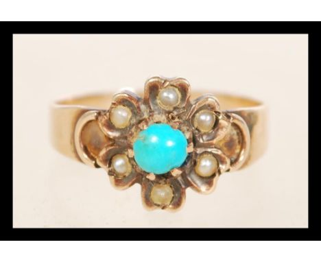 A Victorian gold turquoise and seed pearl flower cluster ring. Unmarked tests gold. Size K.5. Weight 1.9g.&nbsp;