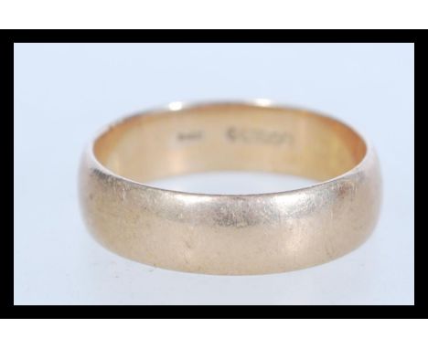 A hallmarked 9ct gold band ring of plain form baring London hallmarks. Weighs 6 grams. Size X.