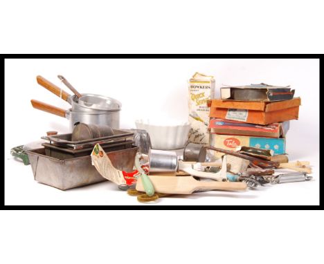 A collection of assorted vintage tin baking accessories and equipment to include; Icing table sets, cake and jelly moulded, d