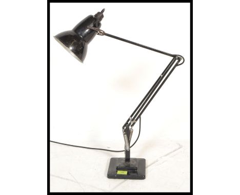 A 1940's Industrial pre-war Herbert Terry anglepoise lamp, raised on a cast metal two step base with pendant shade, finished 