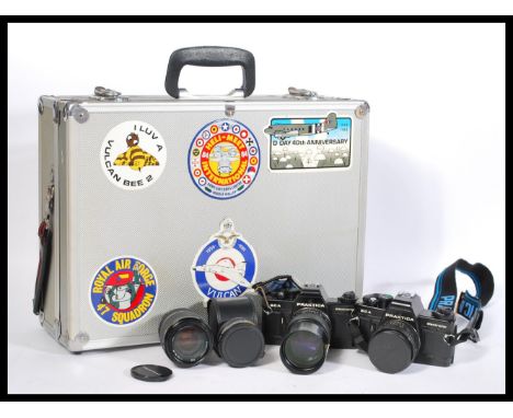 A pair of vintage Praktica 35mm BCA Electronic photographic cameras,with a selection of lenses and accessories all house with