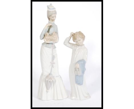 A vintage Lladro figurine titled " Walk With the Dog " and numbered 4893. This 15" tall figure depicts a well-dressed lady wi