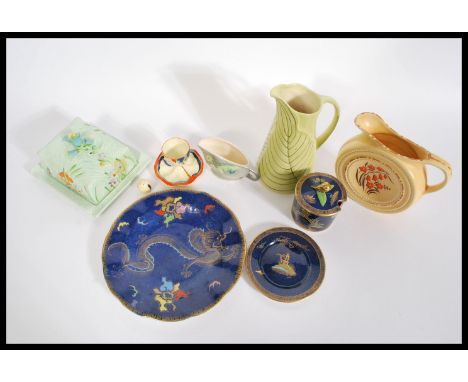 A group of vintage ceramics to include a Carlton ware blue Lustre dragon plate along with a Carlton ware blue luster preserve