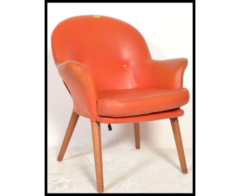 A vintage retro 20th Century Toothill Wingate Series 4 armchair, upholstered in the original orange vinyl raised on tapering 