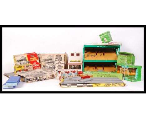 A collection of assorted vintage Airfix slot car racing boxed track and Subbuteo accessories to include; score board , Match 