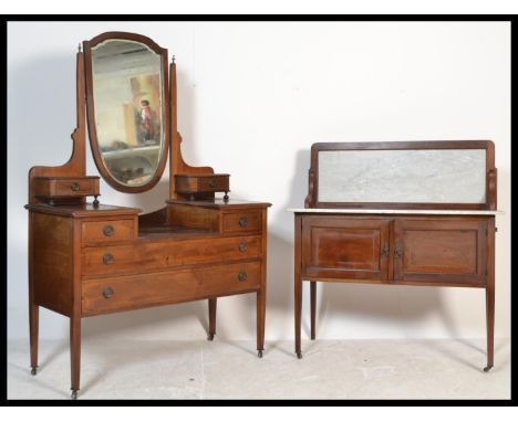 An Edwardian mahogany inlaid dressing table together with a matching mahogany inlaid marble top washstand cabinet. Each raise