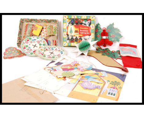 A GOOD collection of vintage mid 20th century Christmas decorations to include an array of paper wall and ceiling decorations