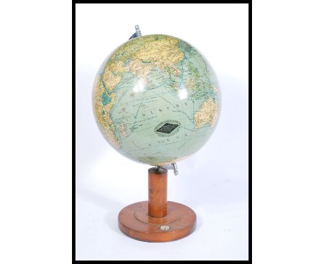 A vintage early 20th Century circa 1930's terrestrial globe, Columbus Erdglobus, C. Luther cartographer upon observations by 