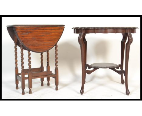 A Victorian mahogany Art Nouveau centre table raised on sabre style legs with undertier together with a 1920's oak small barl