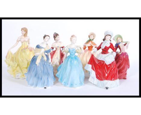 A collection of Royal Doulton ceramic figures to include Adrienne HN2304, Winter HN5314, Autumn Breezes, Autumn HN5323, Summe