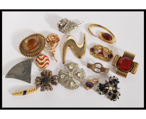 A collection of Vintage brooches to include singed Original by Robert, Les Barnard, Freirich, Art, including a Rebecca Collin