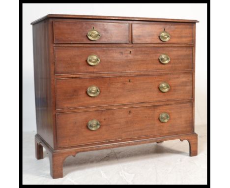 A 19th century mahogany chest of drawers being raised on bracket feet with 2 short over 3 deep drawers having brass handles.&