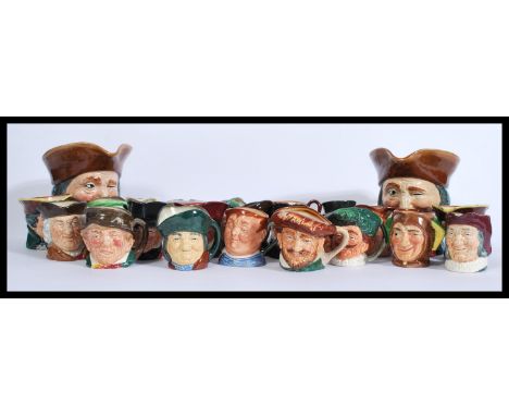 A large collection of vintage early to mid 20th century Royal Doulton Toby Character jugs to include two larger jugs and appr