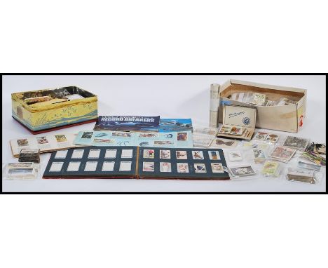 A collection of cigarette and tea cards dating from the 1920's to include Wills Cigarettes First Aid cards, film stars, milit