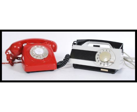 Two retro vintage 20th Century ring dial telephones - phones one in red with phone atop and the other in silver and black by 