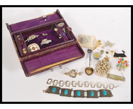 A collection of vintage costume jewellery contained within a vintage jewellery box. Includes silver and marcasite ring, silve