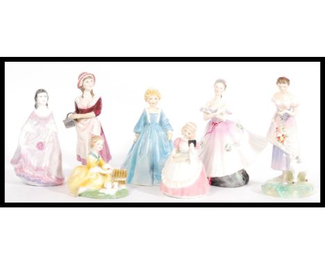 A collection of ceramic figurines to include Royal Doulton Cookie HN 2218, Spring HN 2085, The Ballerina HN 2116, Picnic HN 2