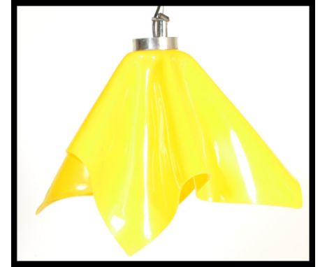 A mid century retro original handkerchief ceiling lamp light having the original vibrant yellow plastic mould shade with fixi
