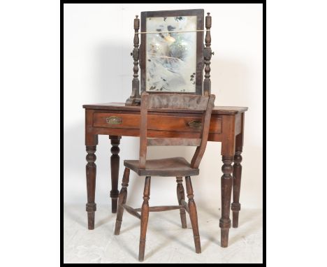 A 19th Century Victorian mahogany writing table / desk having a flared top over single drawer raised on turned supports toget