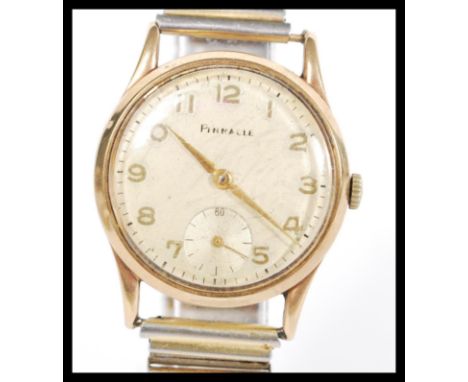 A vintage 20th Century Pinnacle wrist watch in a 9ct gold case having arabic numerals to the chapter ring with faceted hands 