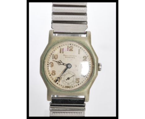 An early 20th Century Art Deco Bravingtons Wetrista gentleman's wrist watch having an angular stainless steel case with a rou