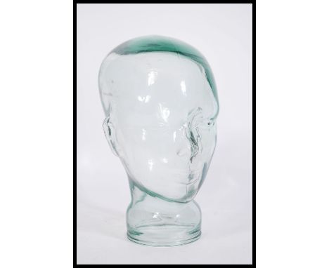 A vintage retro 20th century shop display / millinery mannequin head of pressed glass construction with moulded features.&nbs