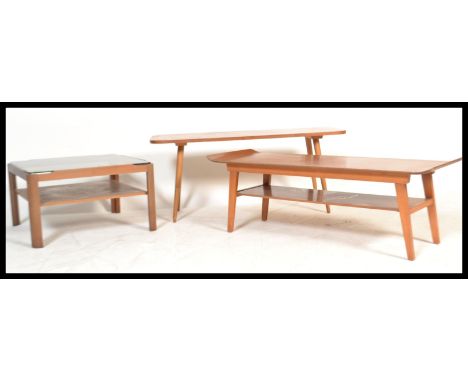 A group of vintage retro 20th Century teak furniture to include a Surfboard coffee table, a Myer glass coffee table and anoth