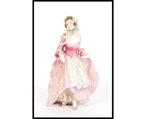 A Royal Doulton ceramic figure entitled Suzette HN1487 having printed and painted marks to base with RD number. Measures 20cm