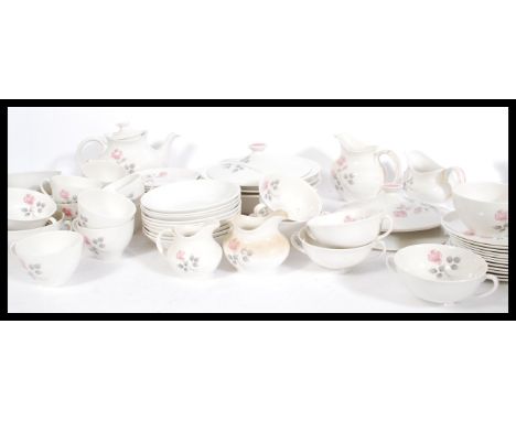 A Royal Doulton English translucent China dinner and tea service in the Pillar Rose pattern. Complete with the cups, saucers,