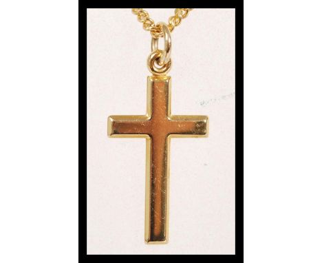 A hallmarked 9ct gold pendant crucifix necklace having a spring ring clasp. International hallmarks, weight 4.8g.