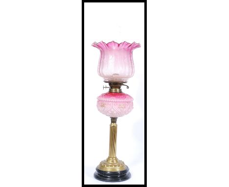 A Victorian brass and vaseline glass oil lamp. Brass neoclassical base and stem with two tone glass reservoir complete with s