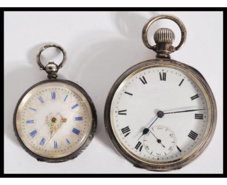 A silver hallmarked gentleman's pocket watch having a round face with roman numerals to the chapter ring and faceted hands, h