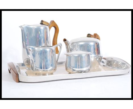 A good vintage retro 20th century iconic Piquet ware tea service consisting of teapot, water pot, sugar bowl, creamer milk ju