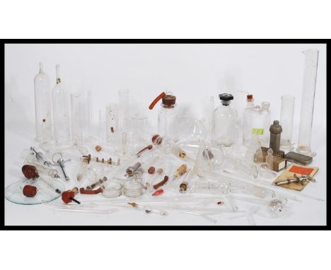 A collection of vintage 20th Century Scientific medical lab glass and instruments to include various phials, test tubes, and 