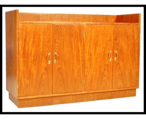 A late 20th century retro vintage teak wood sideboard record hi-fi cabinet comprising of a gallery backed top with two twin d