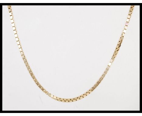 A hallmarked 9ct gold large box link necklace chain having a bolt ring clasp. Weighs 21,4 grams.