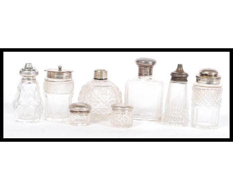 A selection of cut glass and hallmarked silver cruet items to include a Henry Manton cruet (hallmarked Birmingham), two small